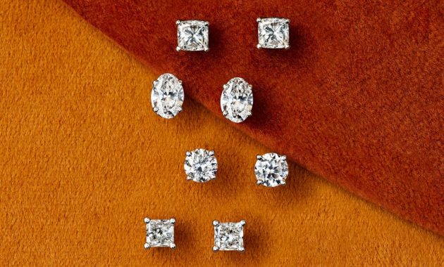 Four pairs of diamond stud earrings as viewed from above.